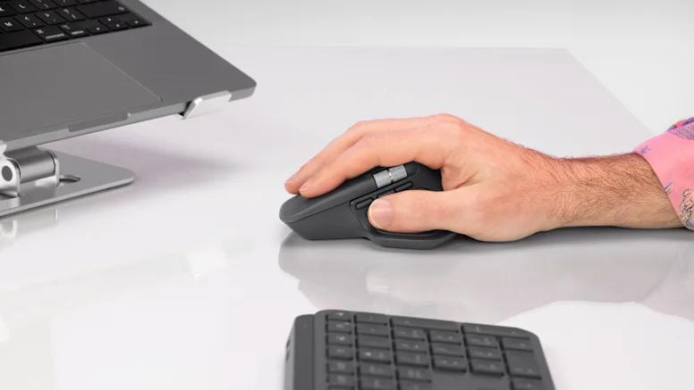 hand-holding-mx-master-4-with-a-side-view-mx-keys-s-placed-beside--feature-4